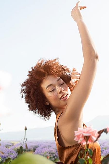 Happy woman in a flower field