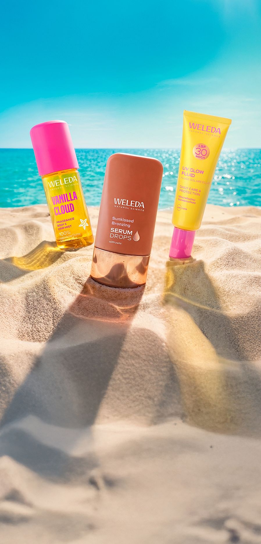 Drei Weleda Produkt am Strand