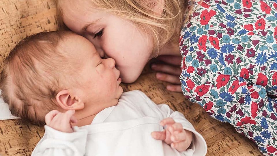 new born with little sister