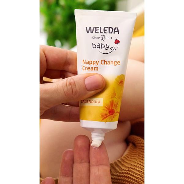 Calendula Nappy Change Cream tube being squeezed.