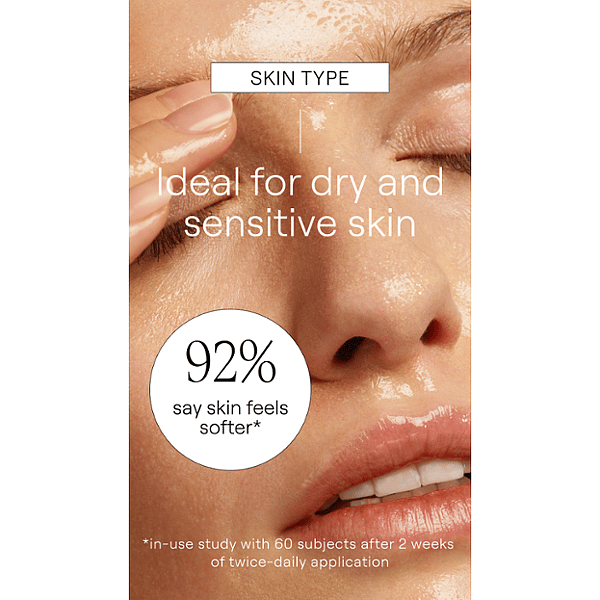 Woman's face with eyes closed using Make-up Removal Cleansing Oil and skin type text for dry and sensitive skin.