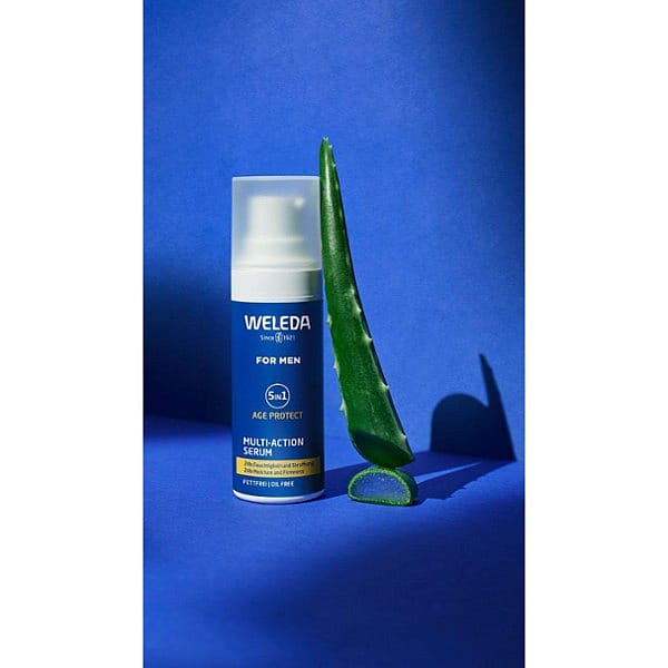 Men 5in1 Serum bottle on blue background with key ingredient aloe vera.