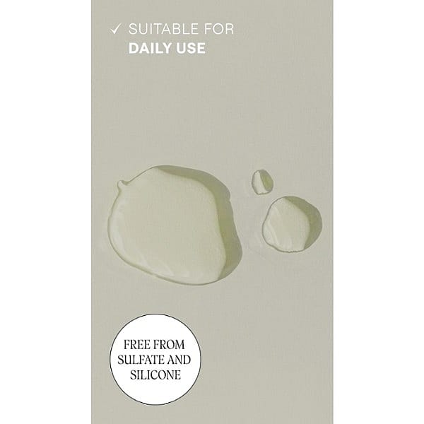 Revitalising Hair Tonic droplets texture on grey background and text suitable for daily use.