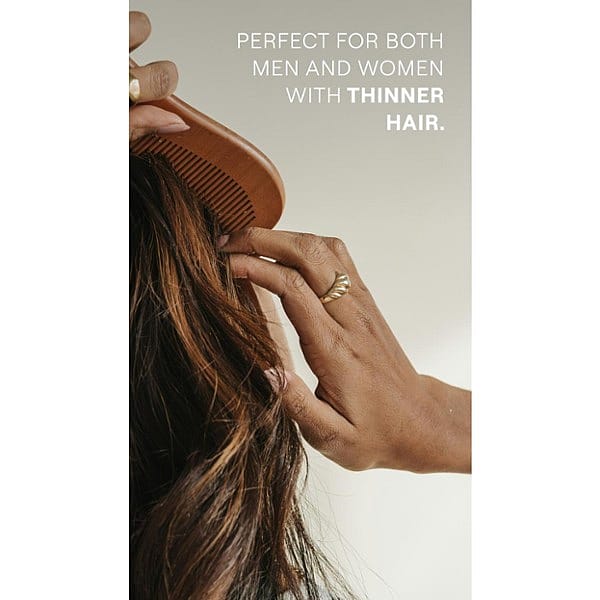 Woman with a wooden comb , combing her hair and Revitalising Hair Tonic benefit text for men and women.