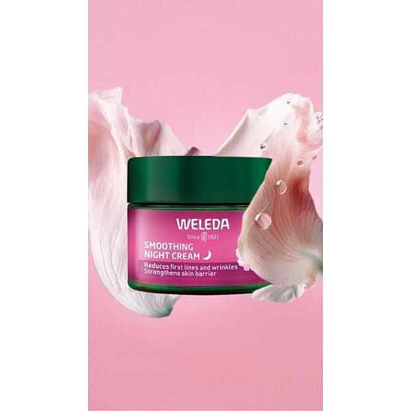 Smoothing Night Cream Wild Rose & White Tea surrounded by a wild rose petal.
