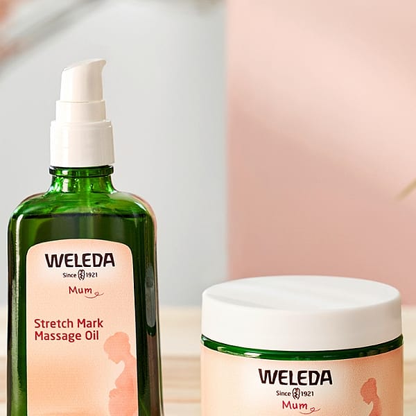 Stretch Mark Massage Oil bottle and Stretch Mark Body Butter jar.
