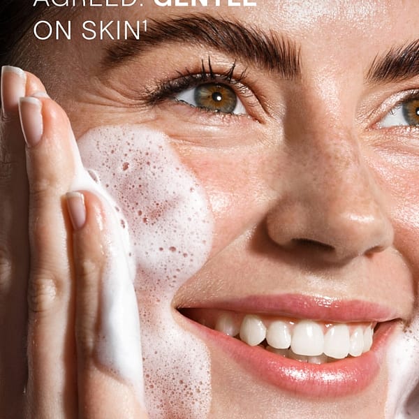 Young woman with Gentle Cleansing Foam on her face and benefits text.