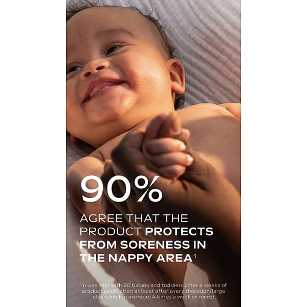 Dark skin baby lying down smiling with hands being held and Calendula nappy change cream fragrance free text