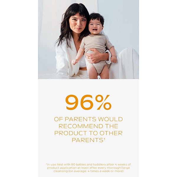 Asian mother crouching down with her toddler son and Calendula nappy change cream fragrance free text.