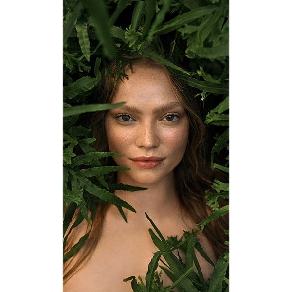girl between leaves