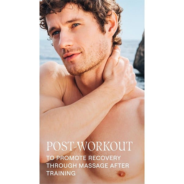 shirtless man by the sea, gently massaging his neck with text.