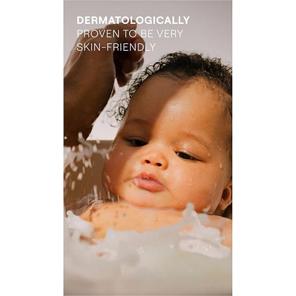 baby bathing in tub with water sprinkles and text.
