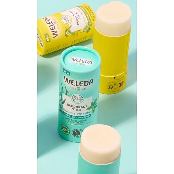 Deodorant Stick Citrus-Bergamot and Eucalyptus-Peppermint open against turquoise background.