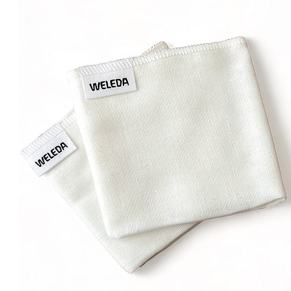two white muslin cloths folded.