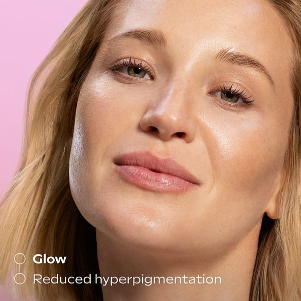 Close-up of a woman with glowing, radiant skin, highlighting the benefits of Glow-Perfecting Serum Booster Drops for improved glow and reduced hyperpigmentation.