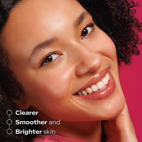 Close-up of a smiling woman with clear, smooth, and bright skin, highlighting the benefits of Pore-Refining Vitamin C Serum Booster Drops for a radiant complexion.